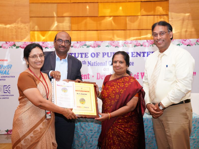 Ms P L Rupa Devi from HAL is Receiving the Excellence Award from Ms. Swarna Sankaran, ED(Fin), ECIL