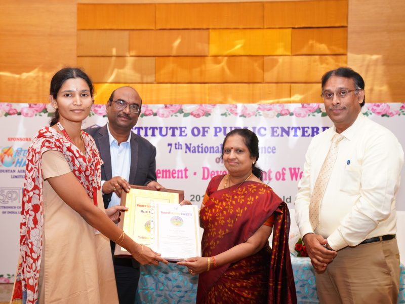 Ms. M Annapurna from BDL is Receiving the Excellence Award from Ms. Swarna Sankaran, ED(Fin), ECIL