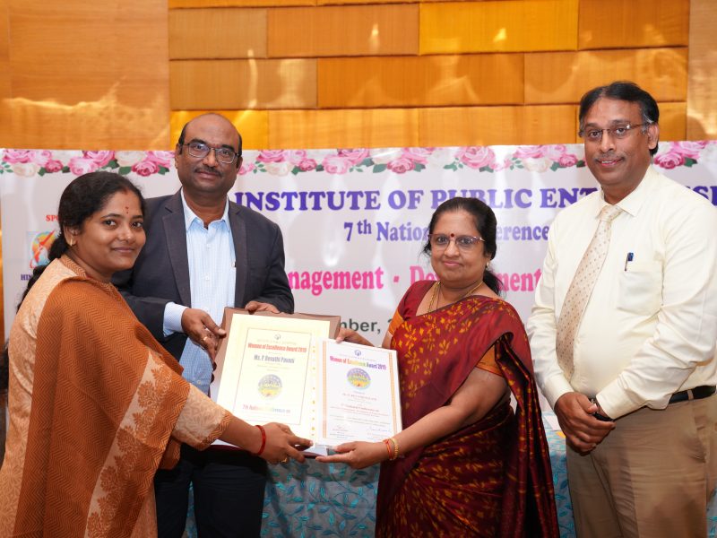 Ms. P Revathi Pavani from HAL is Receiving the Excellence Award from Ms. Swarna Sankaran, ED(Fin), ECIL